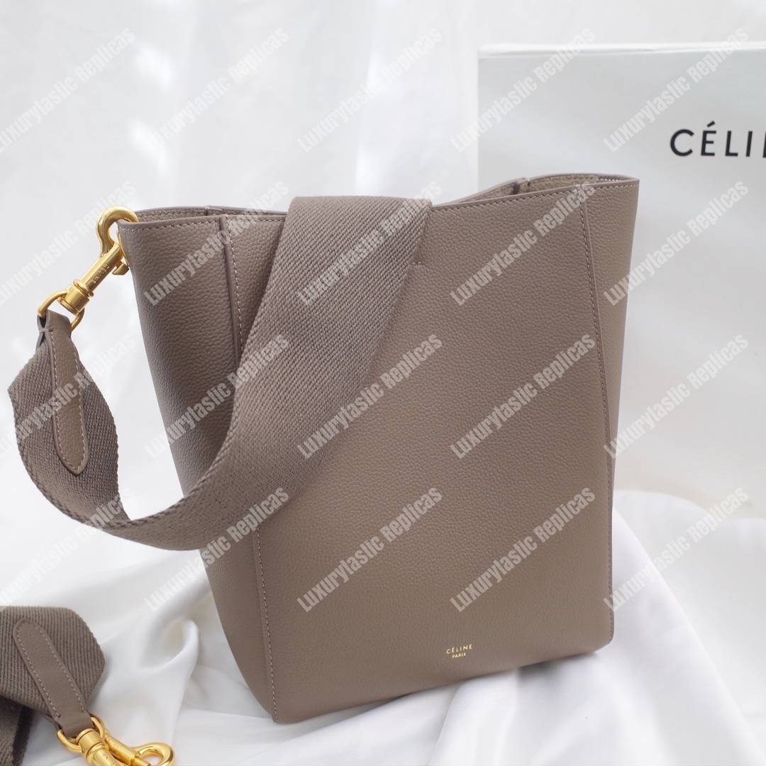 Ce**e sangle small bucket bag in soft grained calfskin taupe