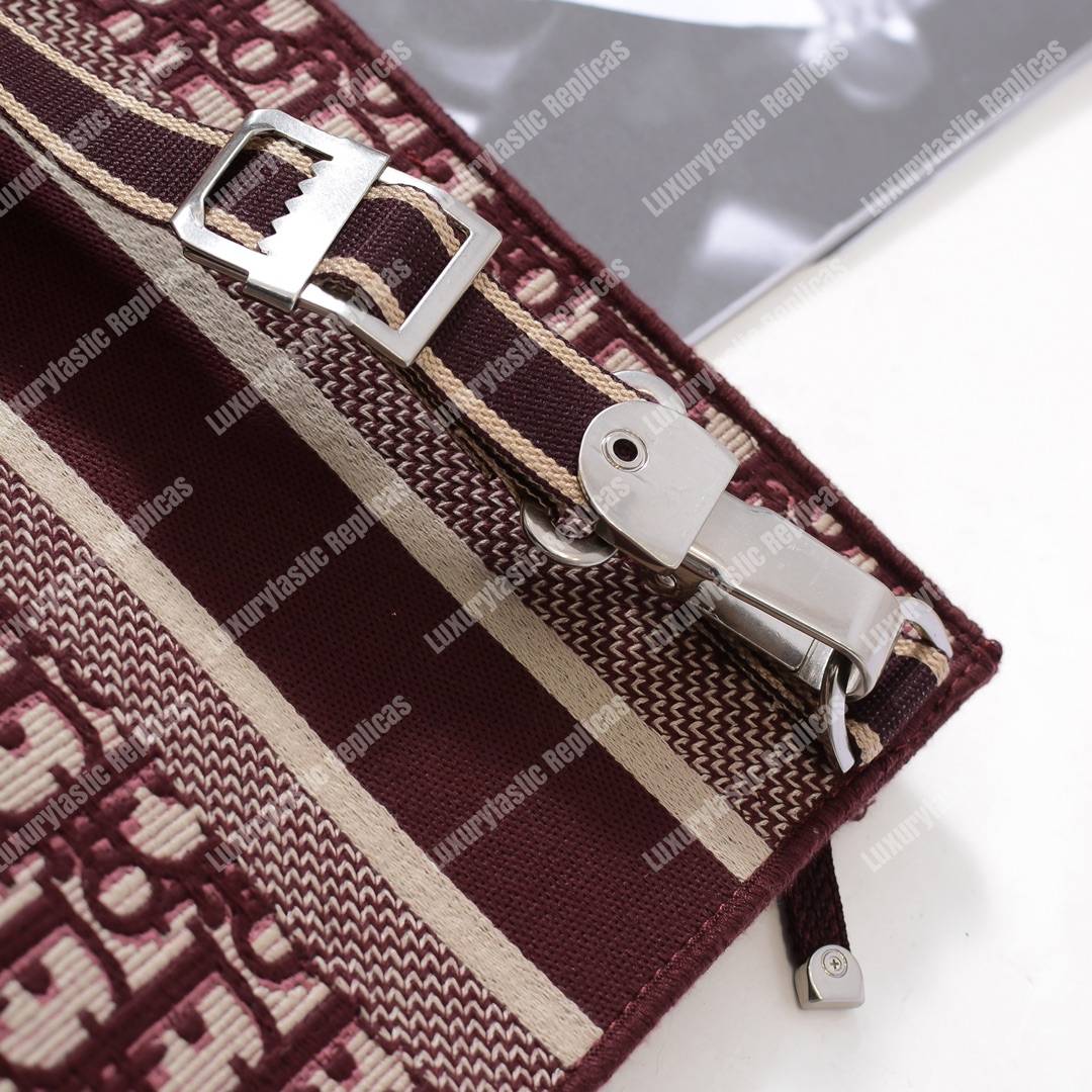 D*or burgundy oblique embroidered canvas clutch