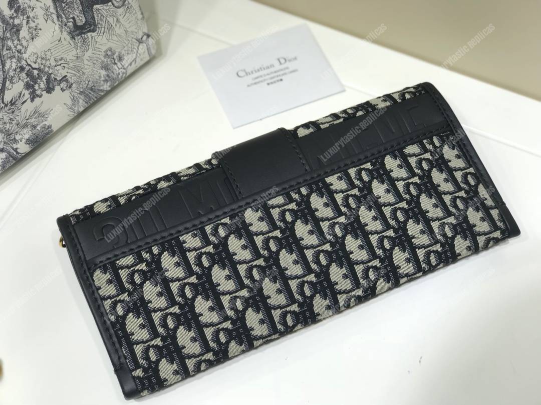 30 Montaigne Jacquard Canvas Clutch Bag Blue