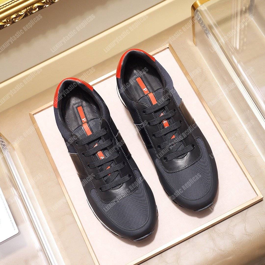 Pra*a fabric and leather sneakers blue/black/orange