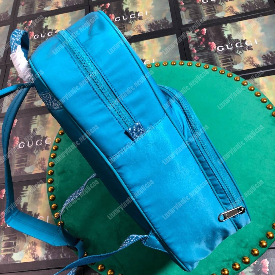 G*u*i medium backpack with G*u*i ’80s patch light blue