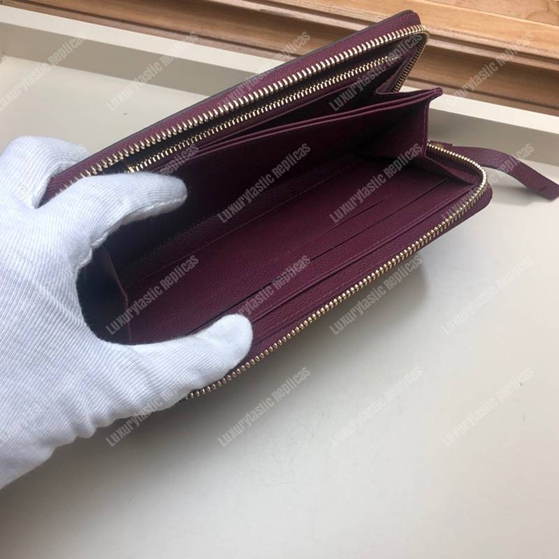 LV Clémence Wallet Monogram Empreinte Leather Raisin