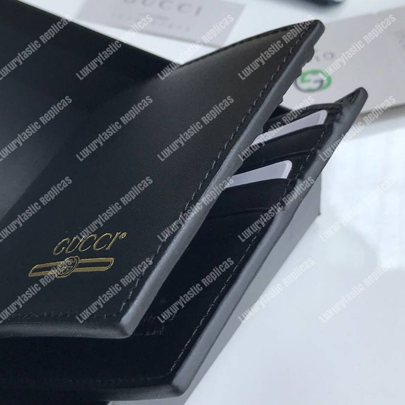 G*u*i leather wallet with G*u*i logo