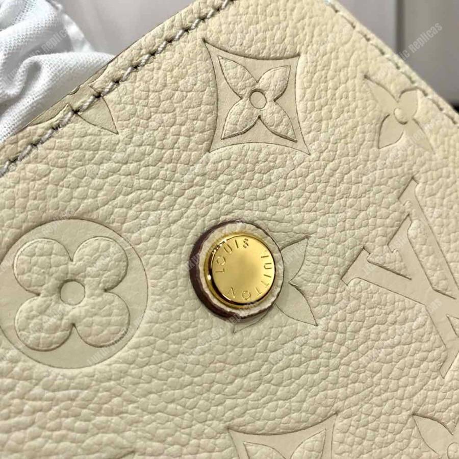 LV Montaigne BB Monogram Empreinte Leather Crème