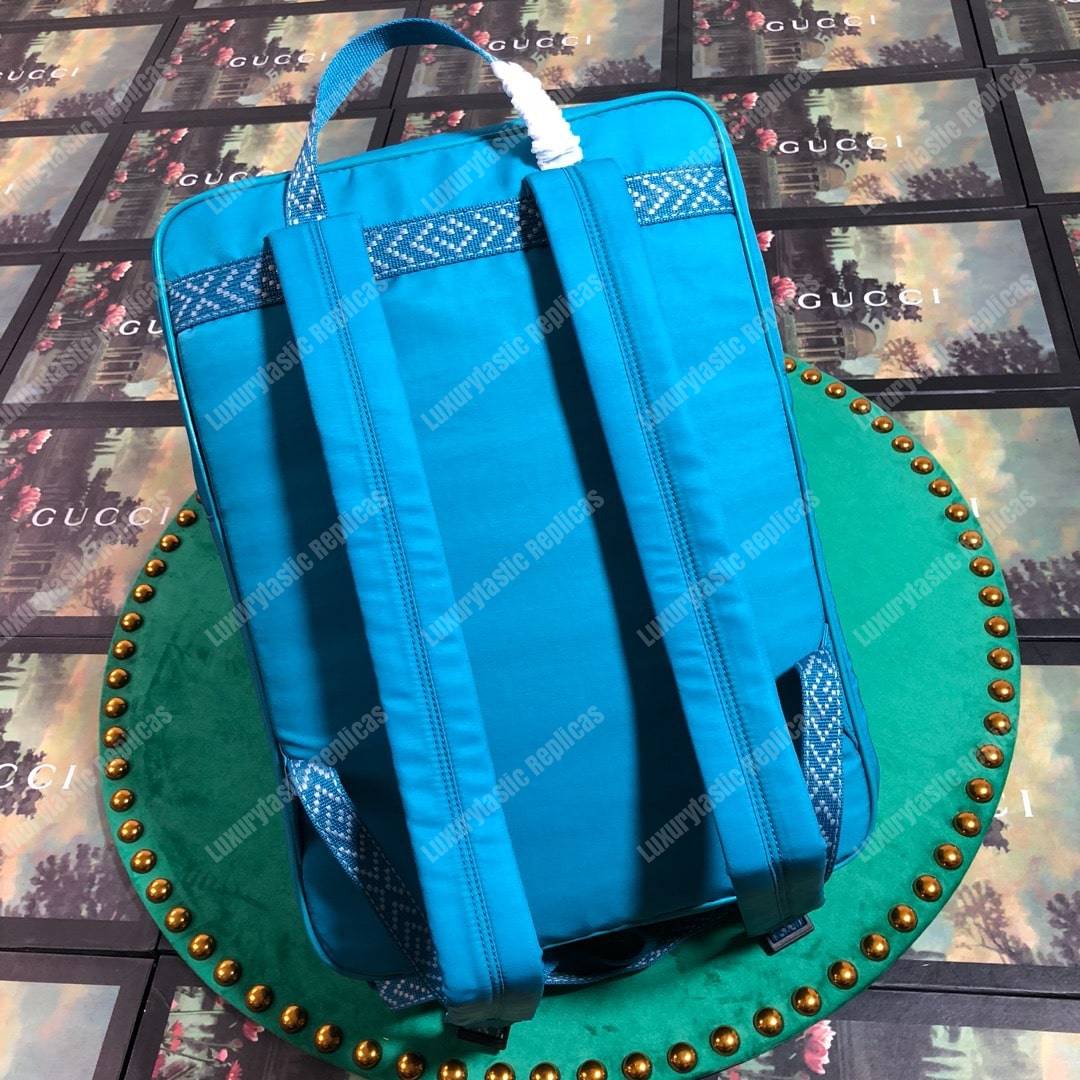 G*u*i medium backpack with G*u*i ’80s patch light blue