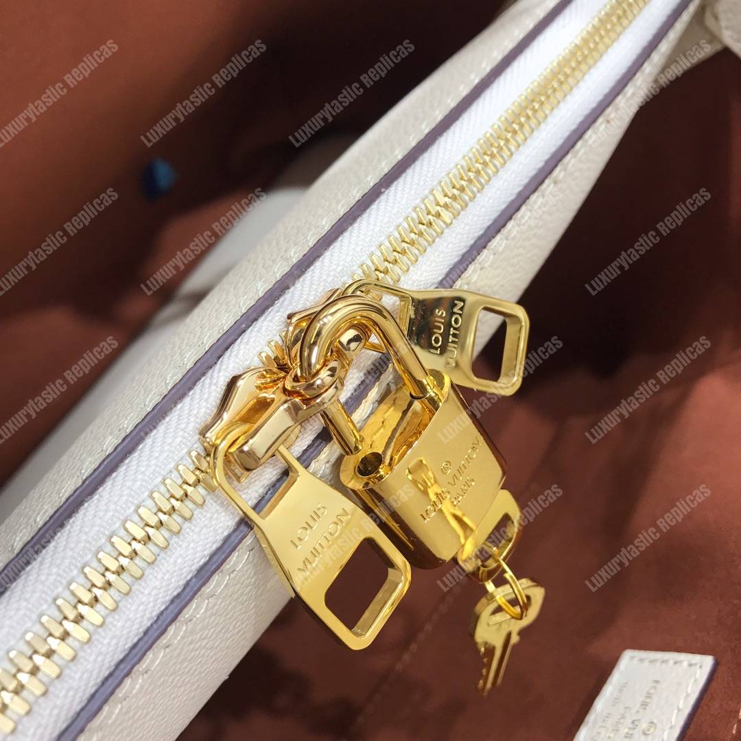 LV Montaigne MM Monogram Empreinte leather Creme